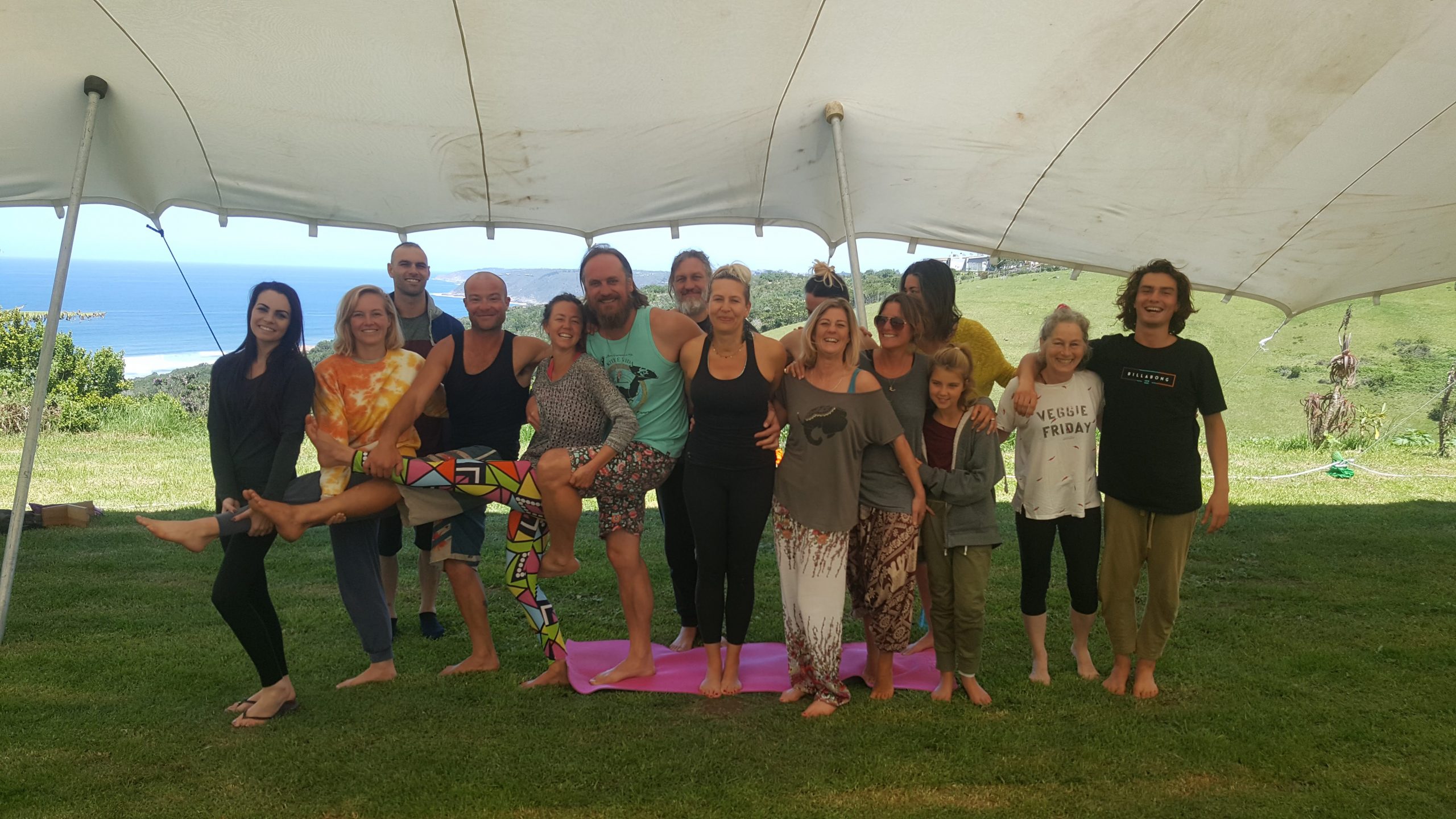 A gathering of Wilderness locals under a stretch tent on the farm lawn